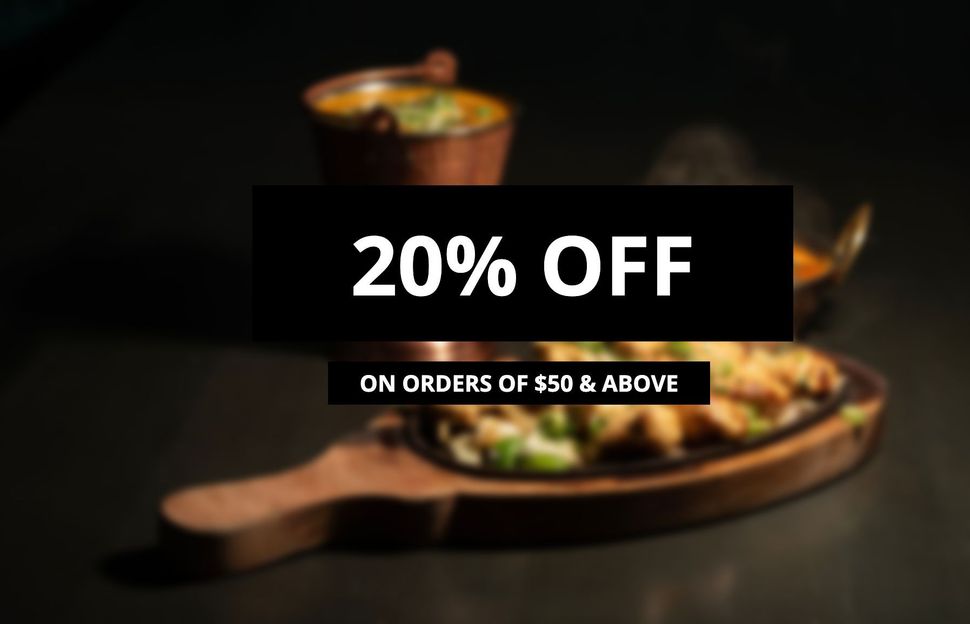 A table topped with bowls of food and the words `` now open ''.