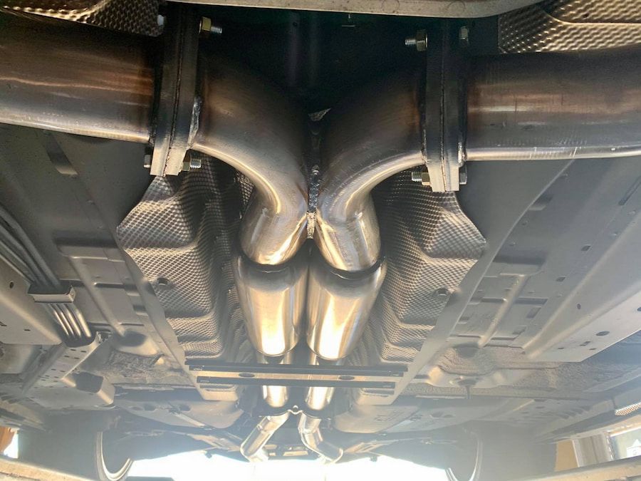 A Close Up Of The Underside Of A Car With Exhaust Pipes — Hannam Street Mufflers and Mechanical In Bungalow, QLD