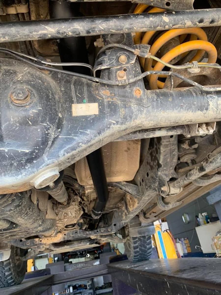 A Close Up Of The Underside Of A Car In A Garage — Hannam Street Mufflers and Mechanical In Bungalow, QLD