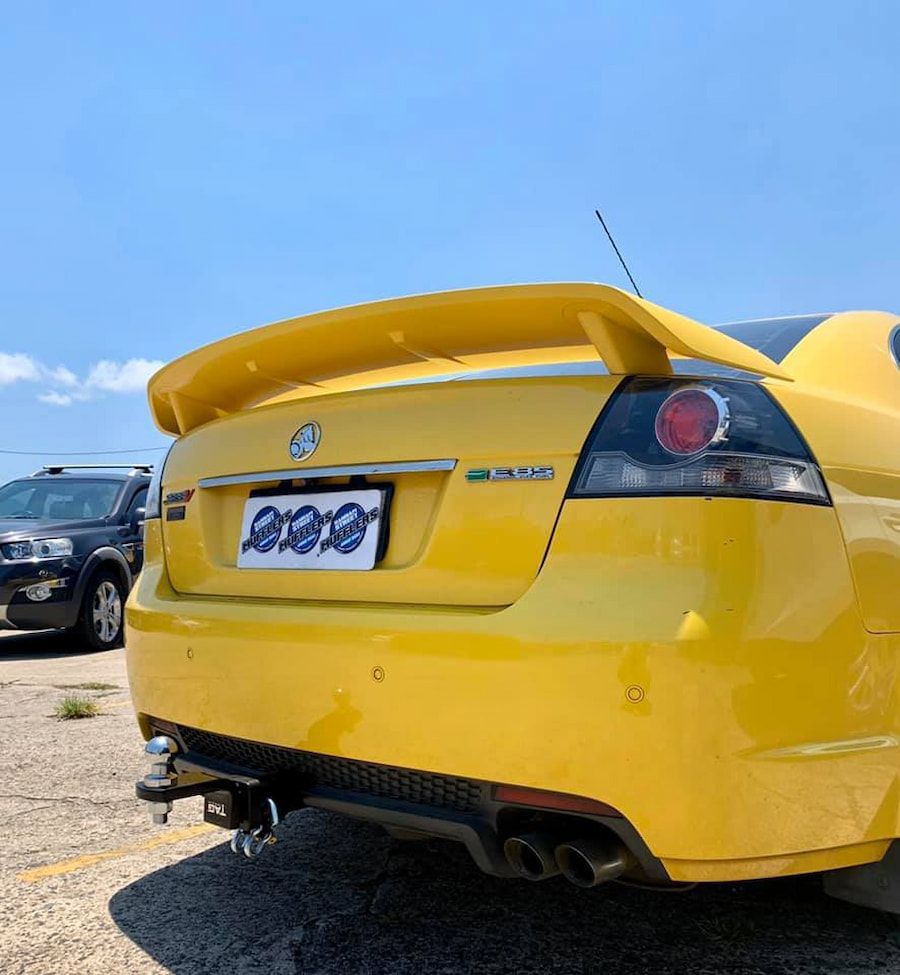A Yellow Car With A License Plate — Hannam Street Mufflers and Mechanical In Bungalow, QLD