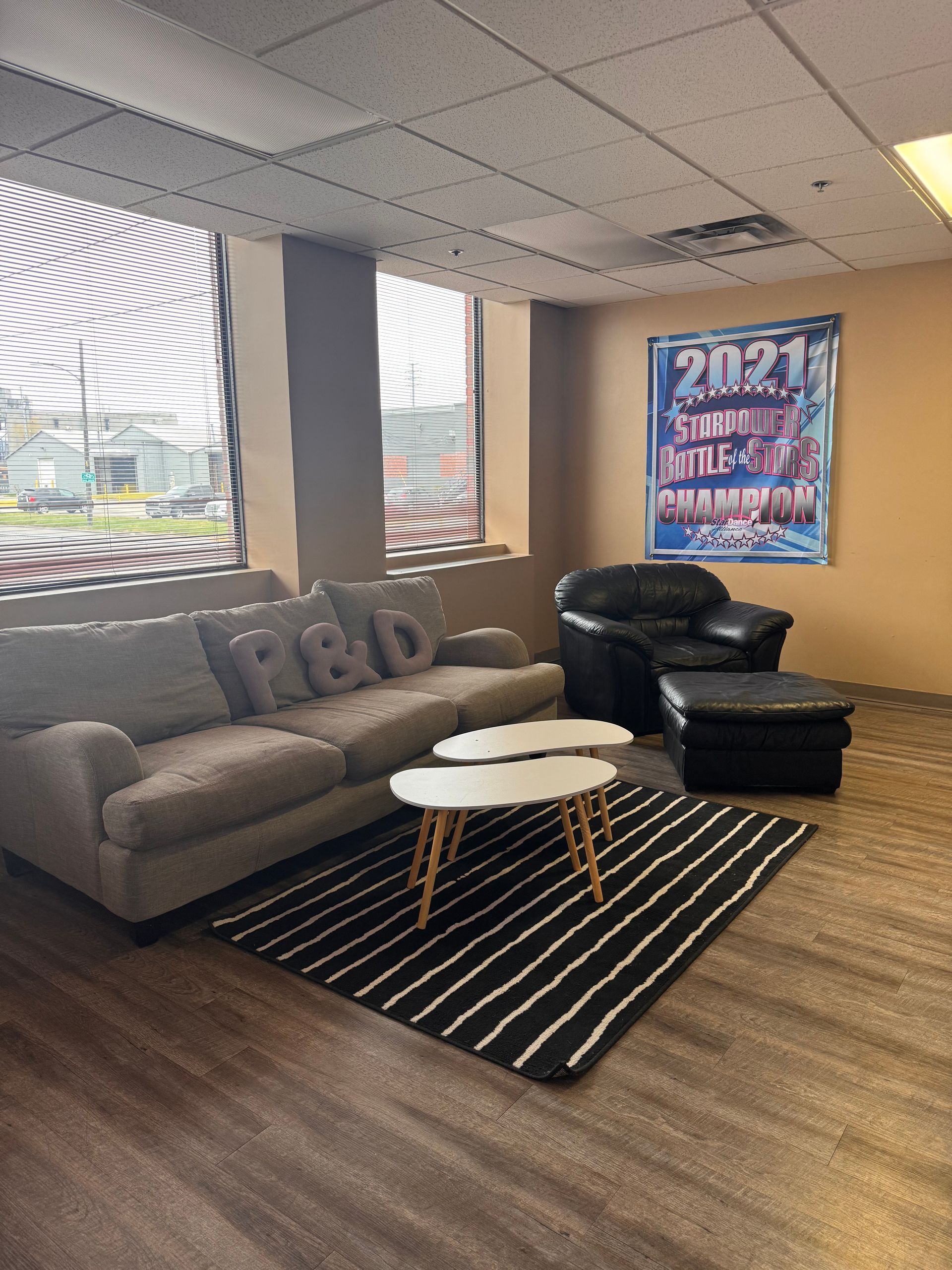A comfortable waiting area featuring a grey couch with 