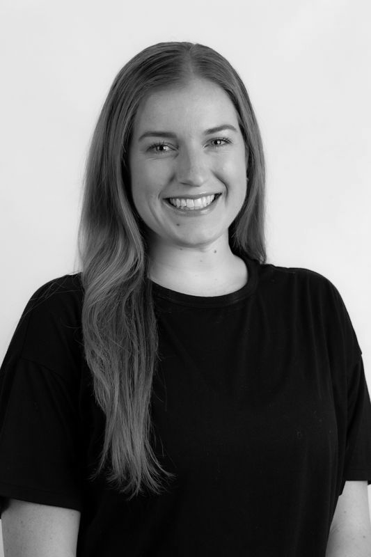 A black and white photo of a woman in a crop top