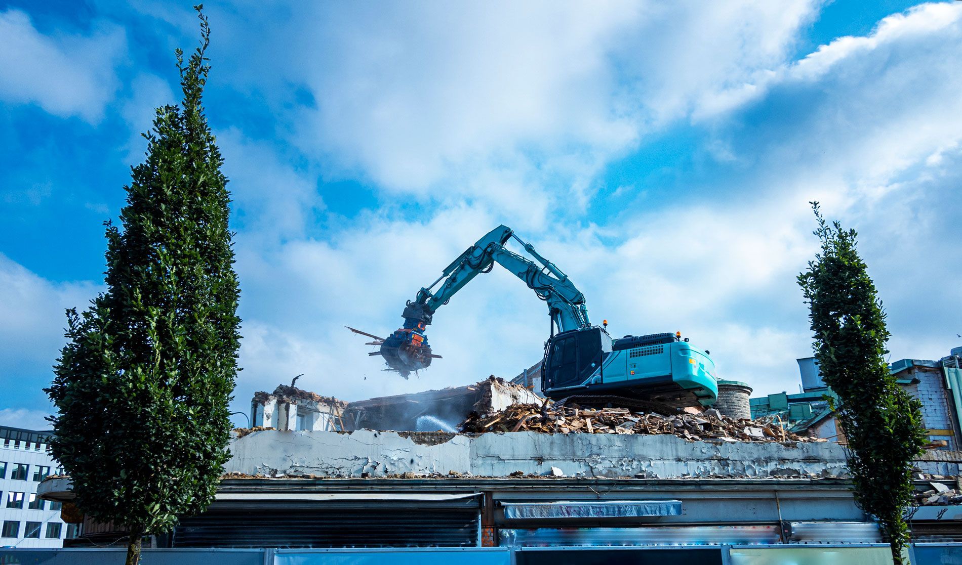 Excavator truck between buildings - Springfield, IL - Jaren Industries