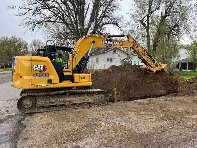 Yellow tractor Preparing soil - Springfield, IL - Jaren Industries