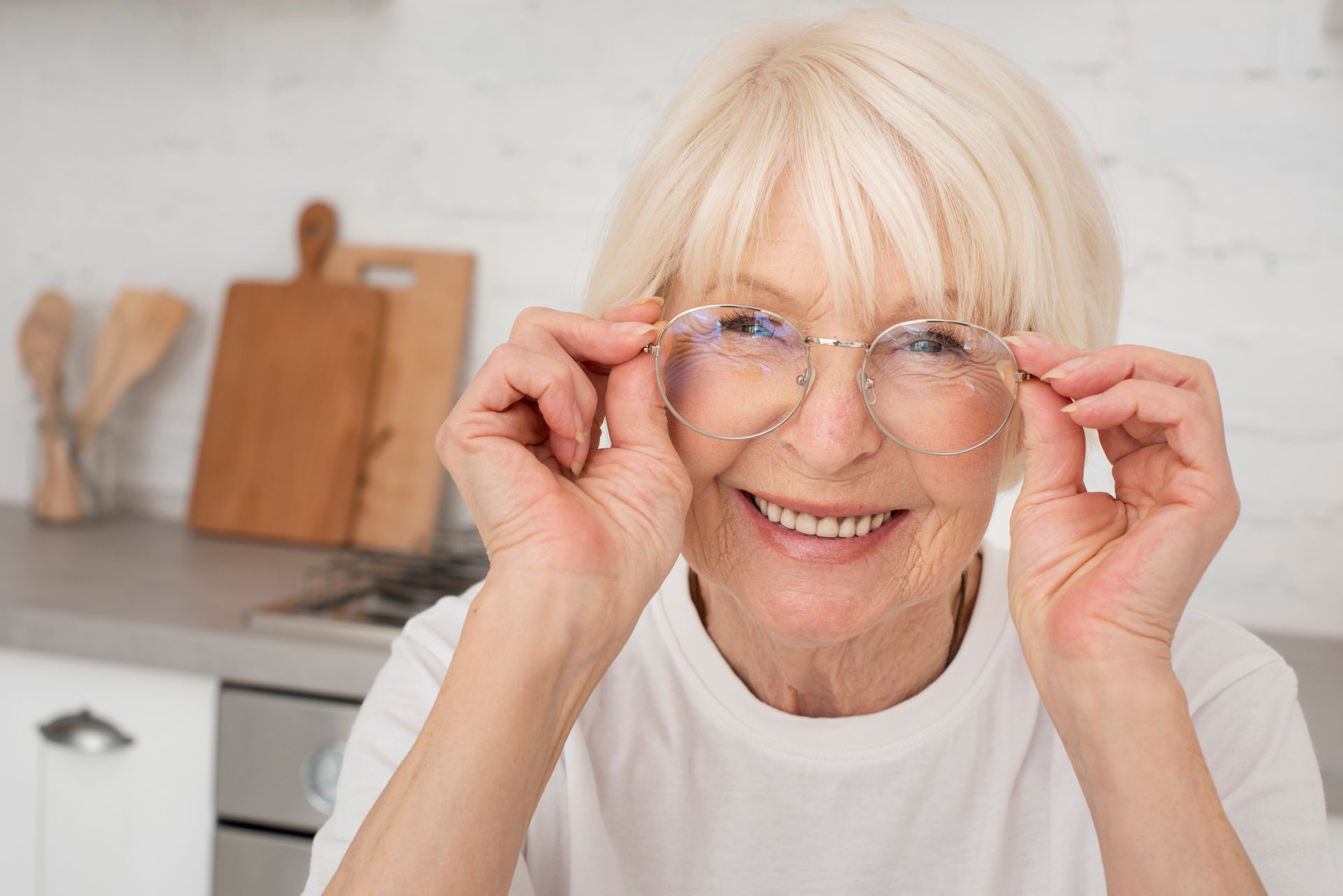 older woman smiling with glasses