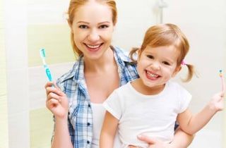 Happy mom and kid — Dental Care in Bridgewater, MA