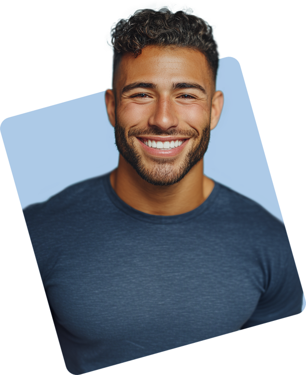 Man with dark curly hair and beard, smiling widely, wearing a blue shirt. Set against a light blue background.