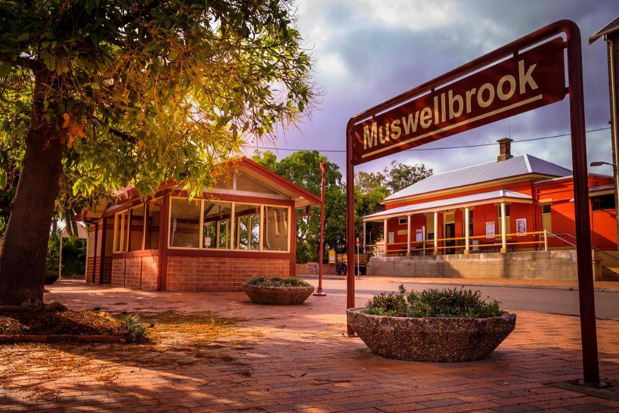 A Sign that Says Muswellbrook Is in Front of A Building — Podium Solar in Muswellbrook, NSW