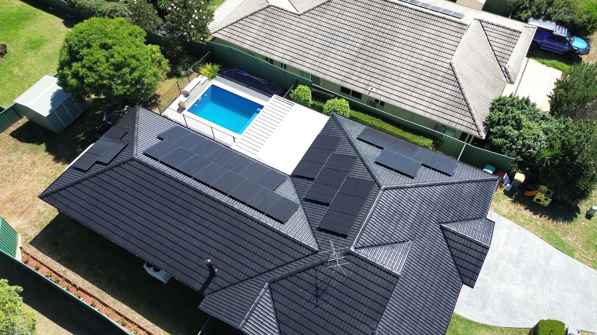 An Aerial View of A House with Solar Panels on The Roof — Podium Solar in Cameron Park, NSW