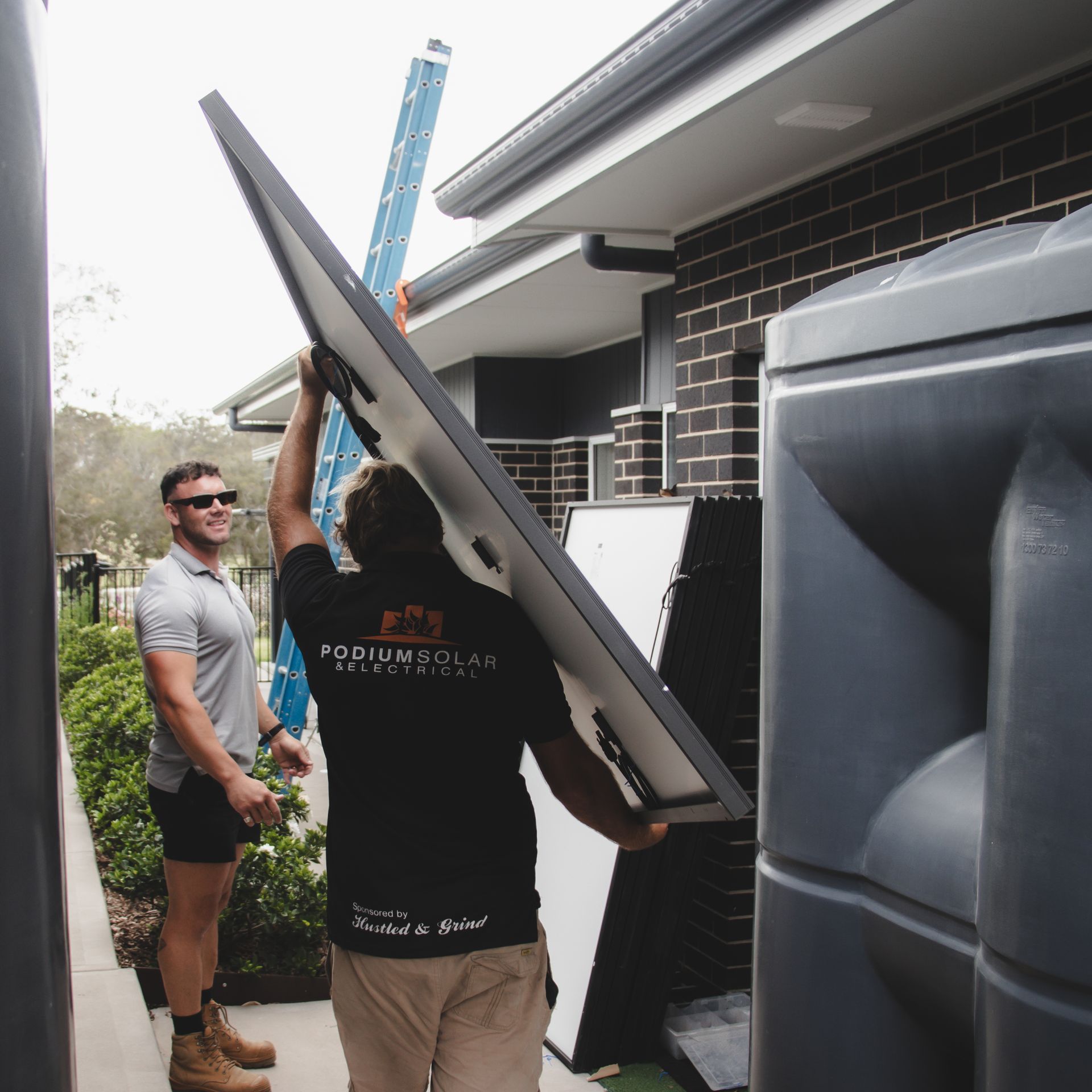 A Man Wearing A Black Shirt With The Word Residence On It  — Podium Solar in Cameron Park, NSW