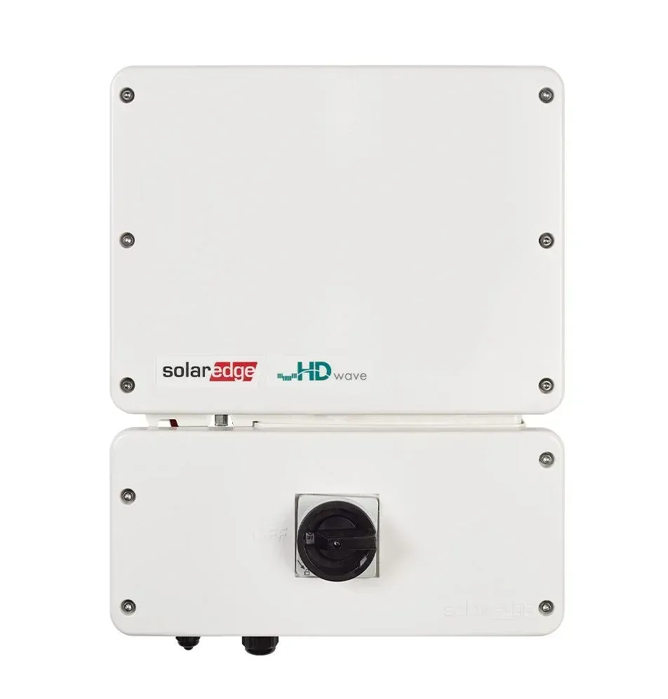 A solar inverter is sitting on top of a white surface.