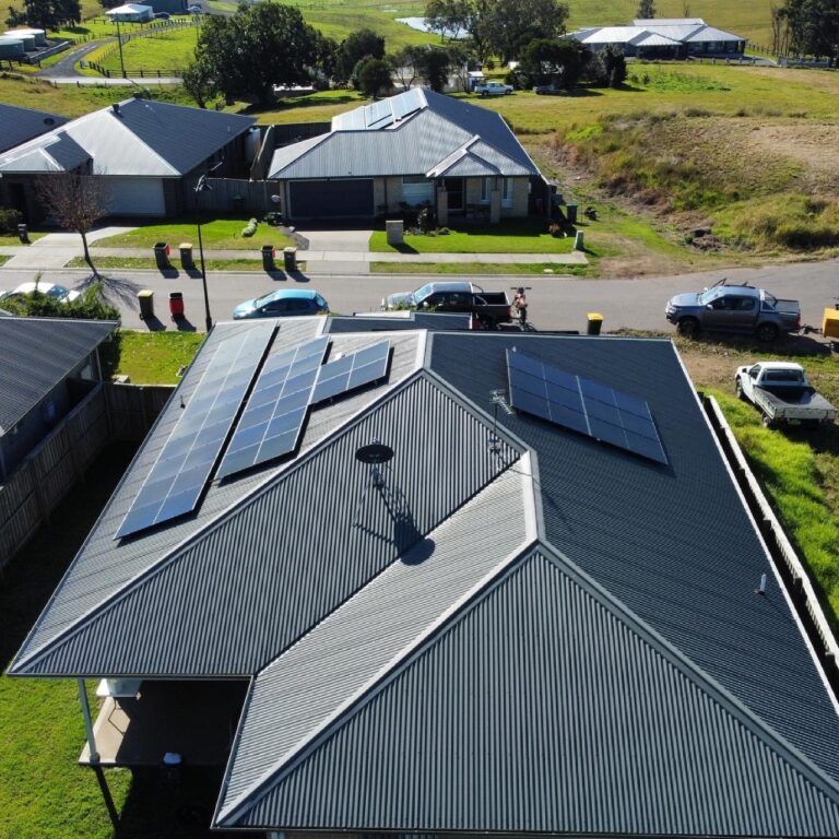 An Aerial View of A House with Solar Panels on The Roof — Podium Solar in Cameron Park, NSW