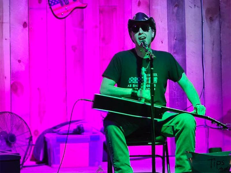 Musician Blind Joe singing in from of an audience at the 17 Club in Glendive Montana