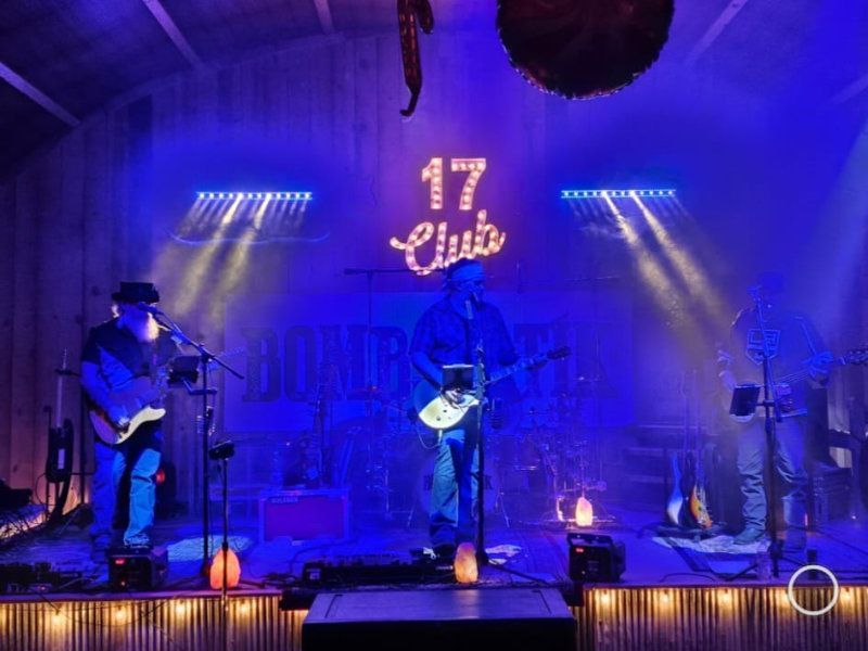 Bomb Statik in front of the audience on a brightly lit stage in Glendive