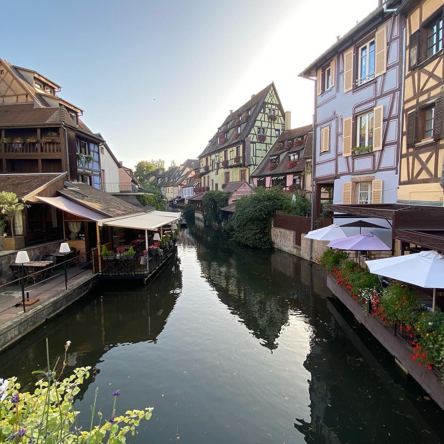A row of half timbered buildings along a river