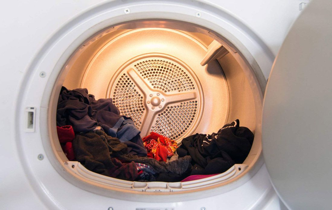 The Inside of a Clothes Dryer is Filled With Clothes — A.S.A.P. Appliance Service & Sales in Toukley, NSW