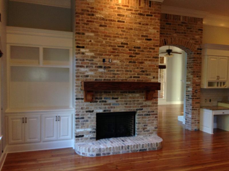 There is a fireplace in the middle of the room.