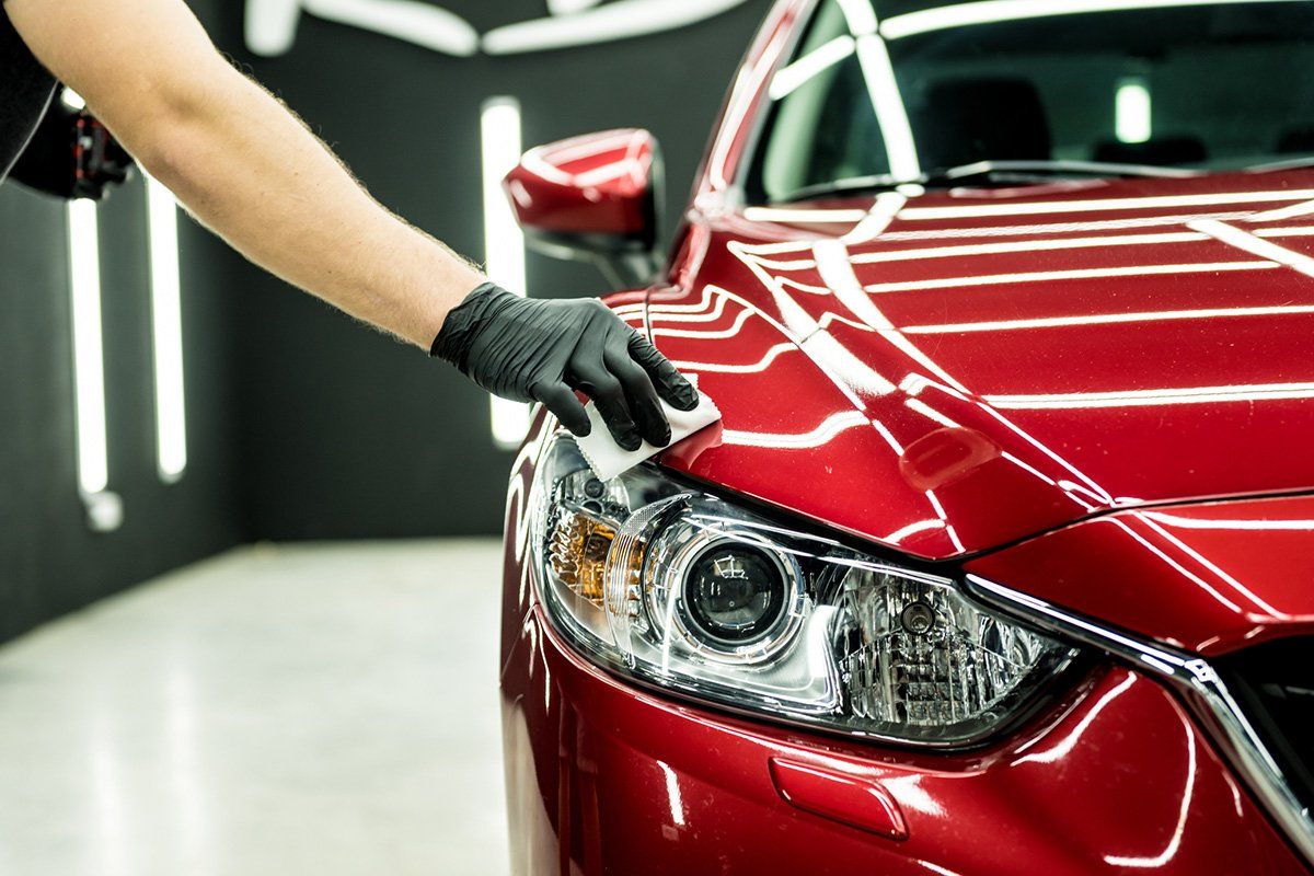 Car Service Worker Applying Coating on a Car — Grants Pass, OR — ROUTE 97 AUTO DETAILING