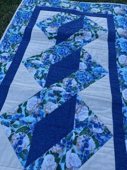 Blue and White Floral Quilt — Lyn-Jelle Crafts in Emu Park, QLD