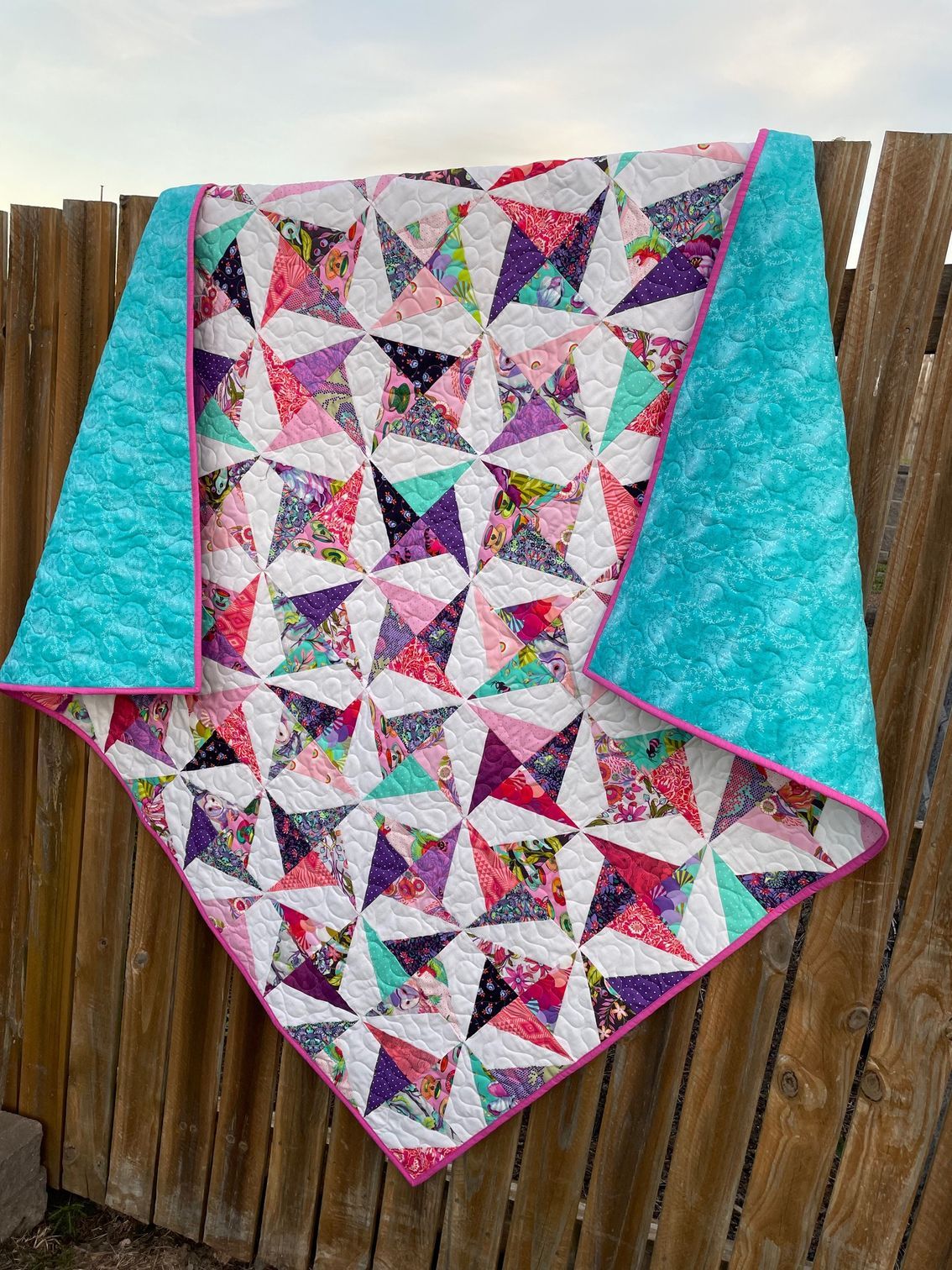Quilt With Teal Backing and Pink Binding — Lyn-Jelle Crafts in Emu Park, QLD