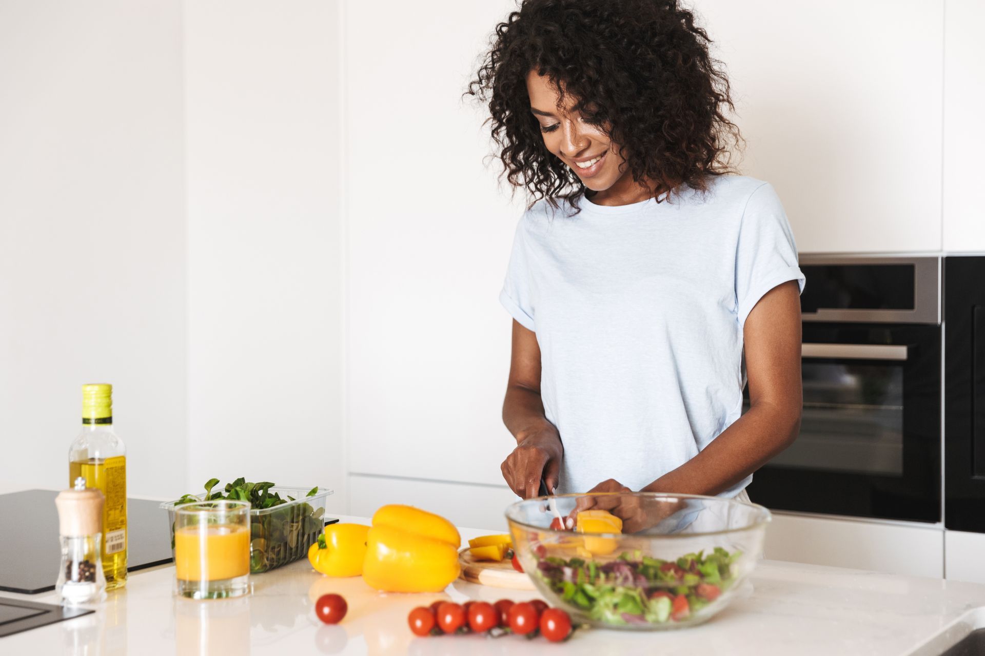 woman at home preparing a healthy meal