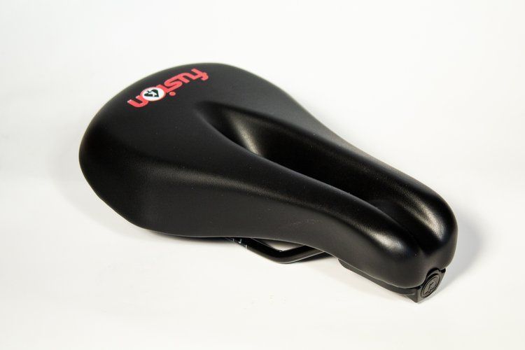 A black bicycle seat with the word fusion on it
