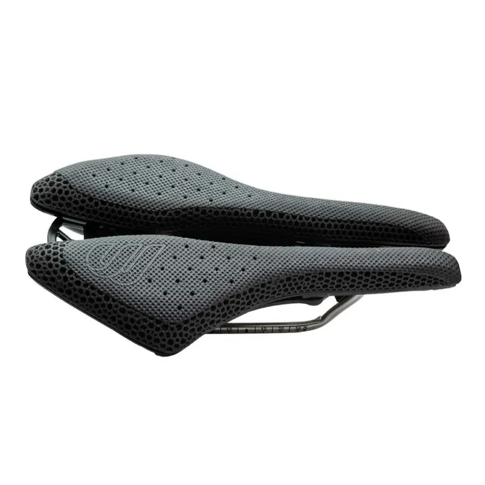 A black bicycle saddle with holes in it on a white background.