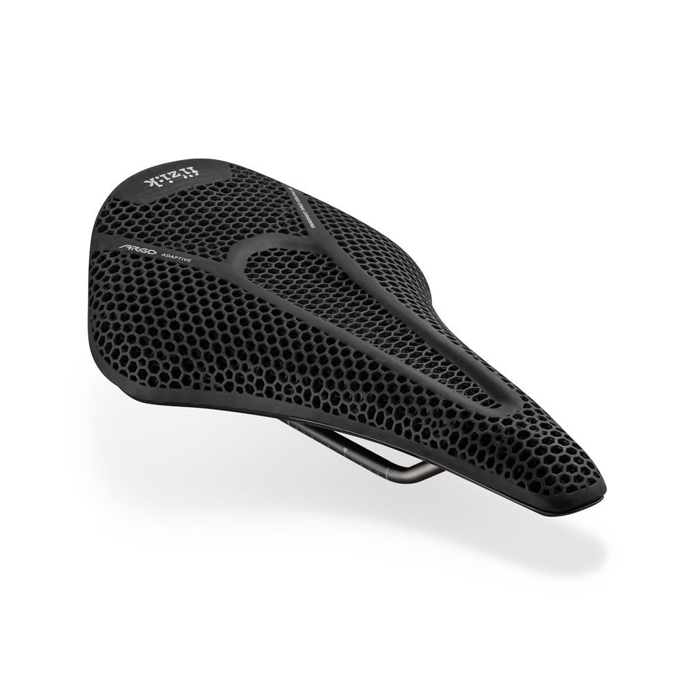 A close up of a black bicycle saddle on a white background.