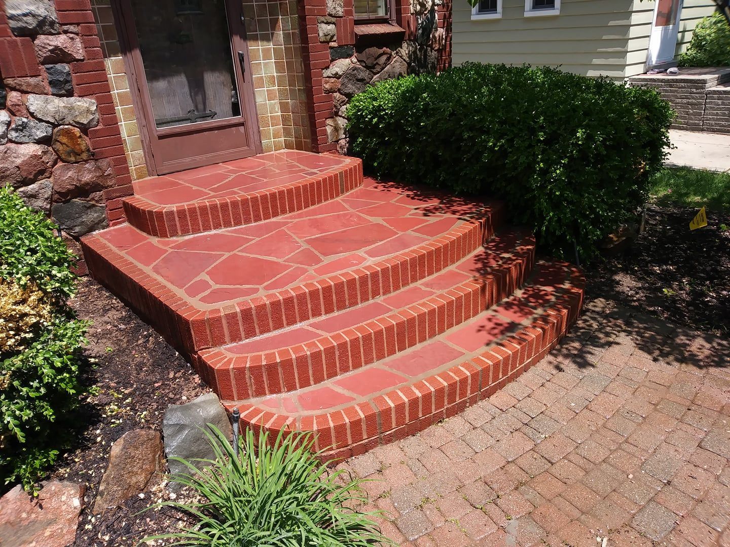 A set of brick steps leading up to a house