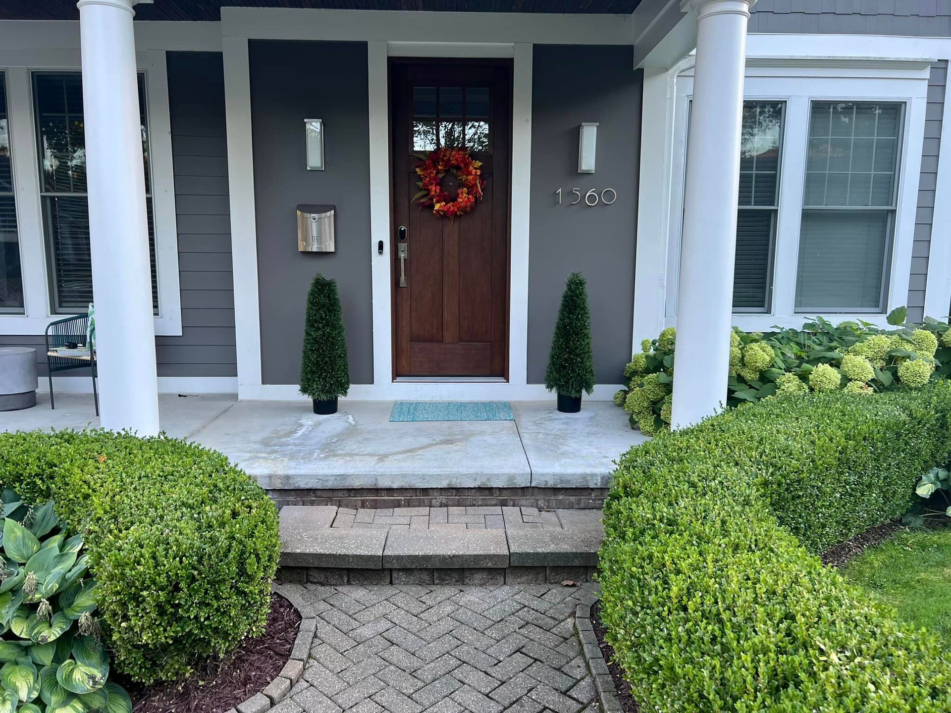 The front door of a house with a wreath on it