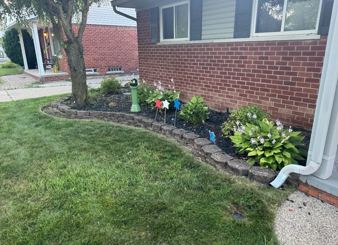 A brick walkway leading to the front door of a house.
