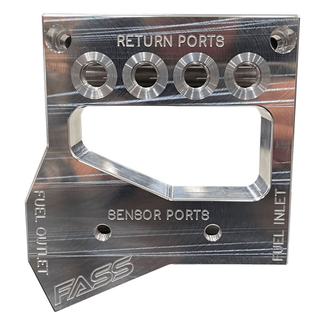 Silver metal fuel rail adapter plate with return, sensor, and fuel ports.