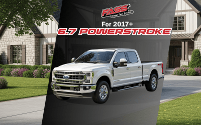 A white ford truck is parked in front of a house.