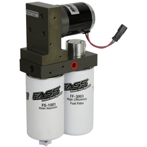 A FASS diesel fuel system unit featuring a motor, a pump, and two vertical fuel filters mounted on a metal block.