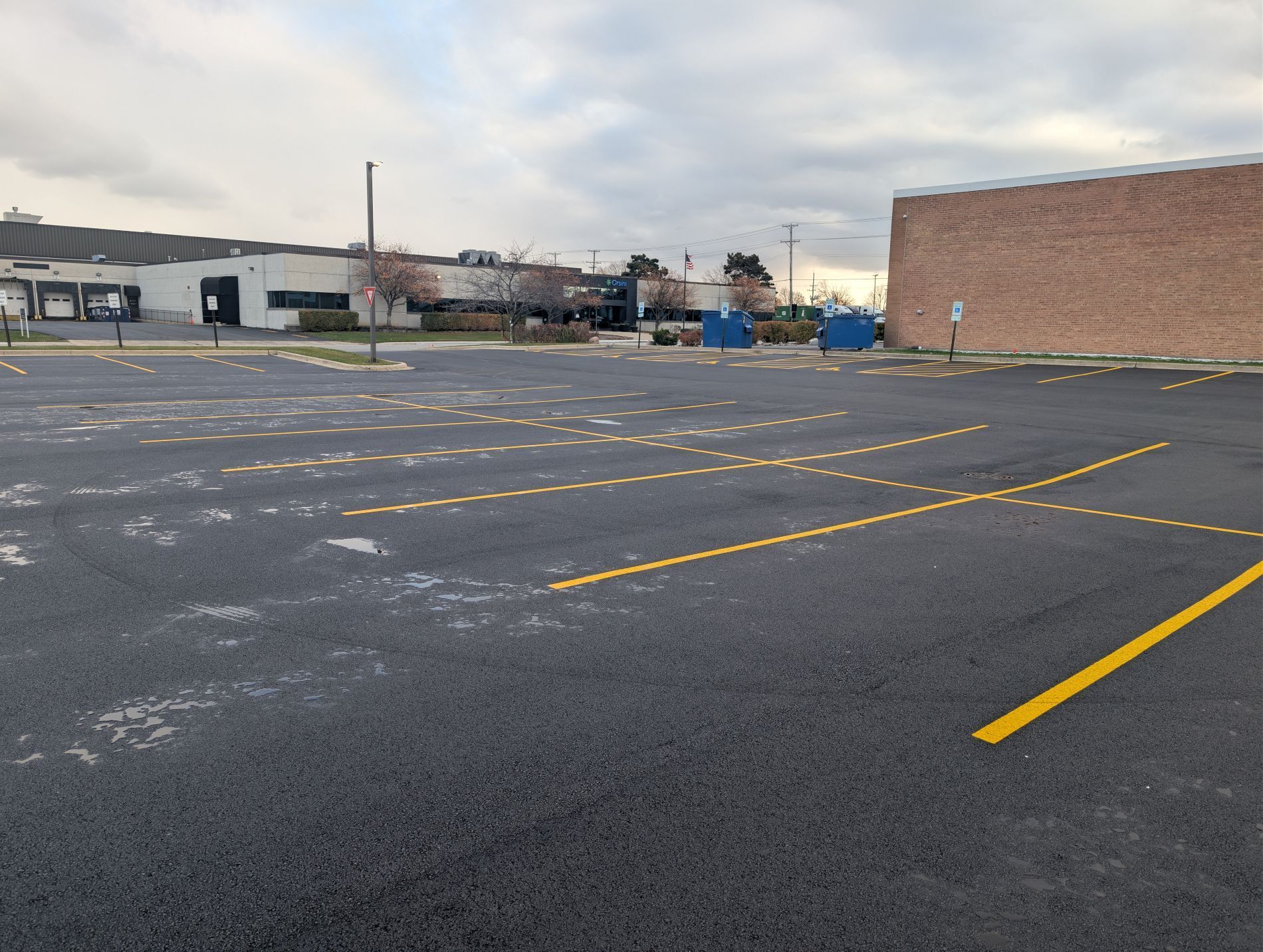 A brick driveway leading to a brick house
