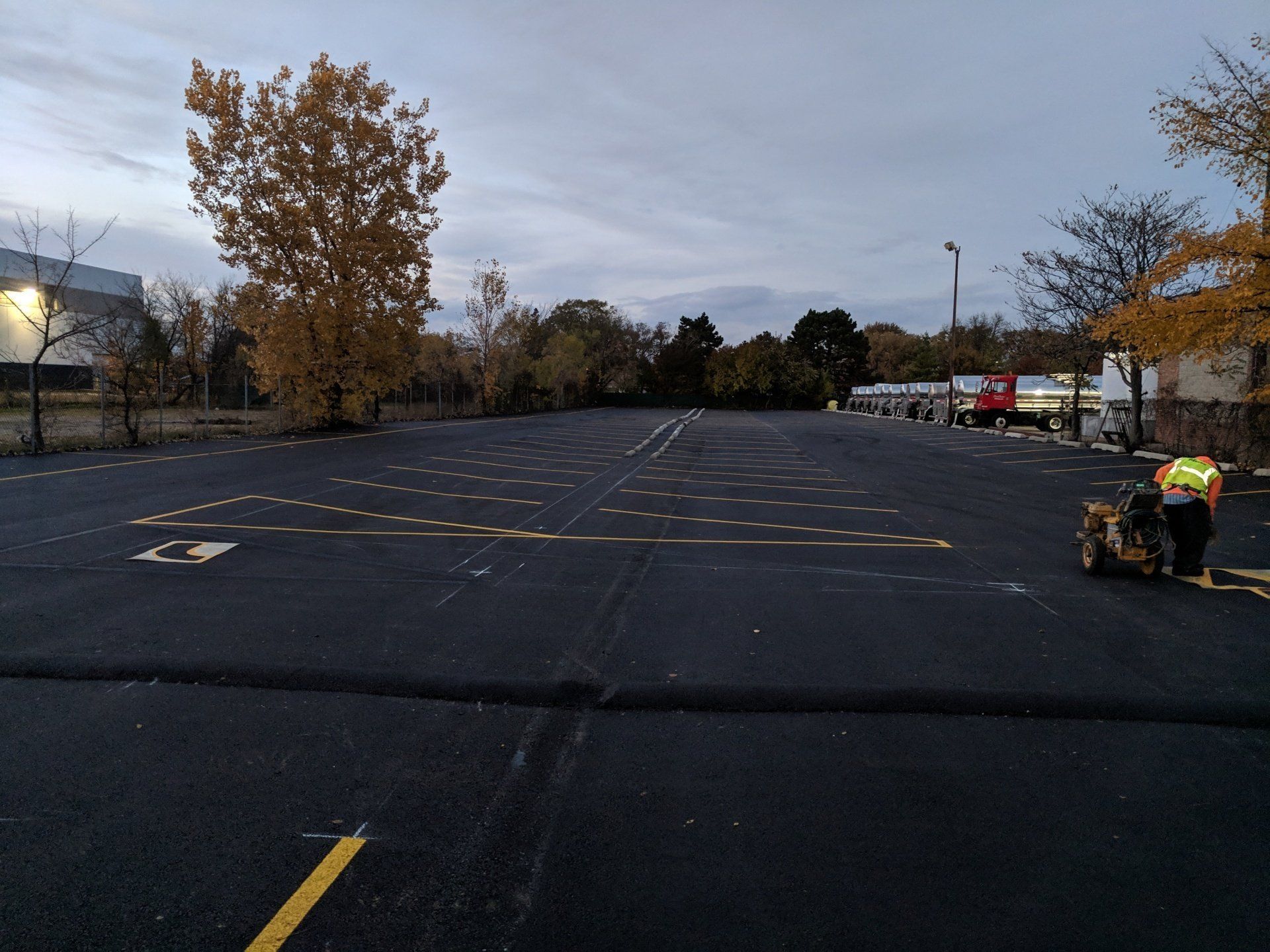 A large parking lot with a yellow line in the middle