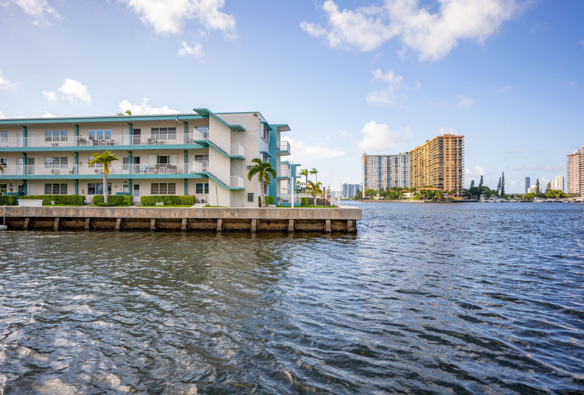 Condos on the water with a deteriorating seawall.