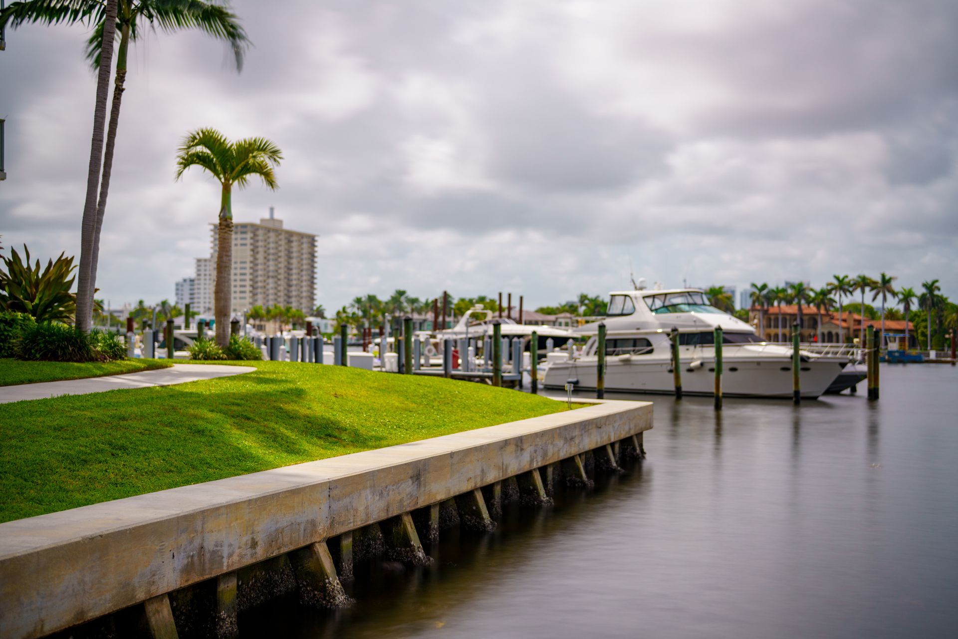 Seawall inspection of modern concrete structure with motion blur showing coastal protection detail.