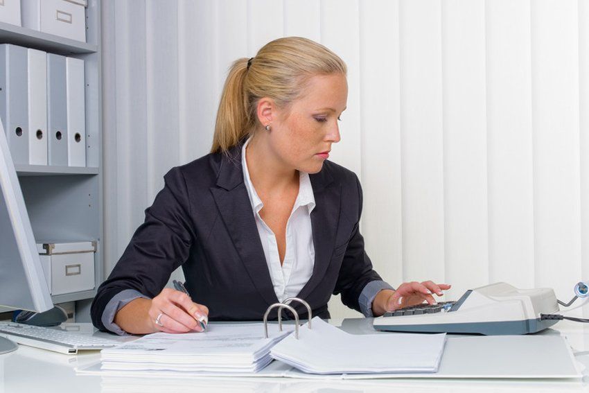 a lady accountant calculating information