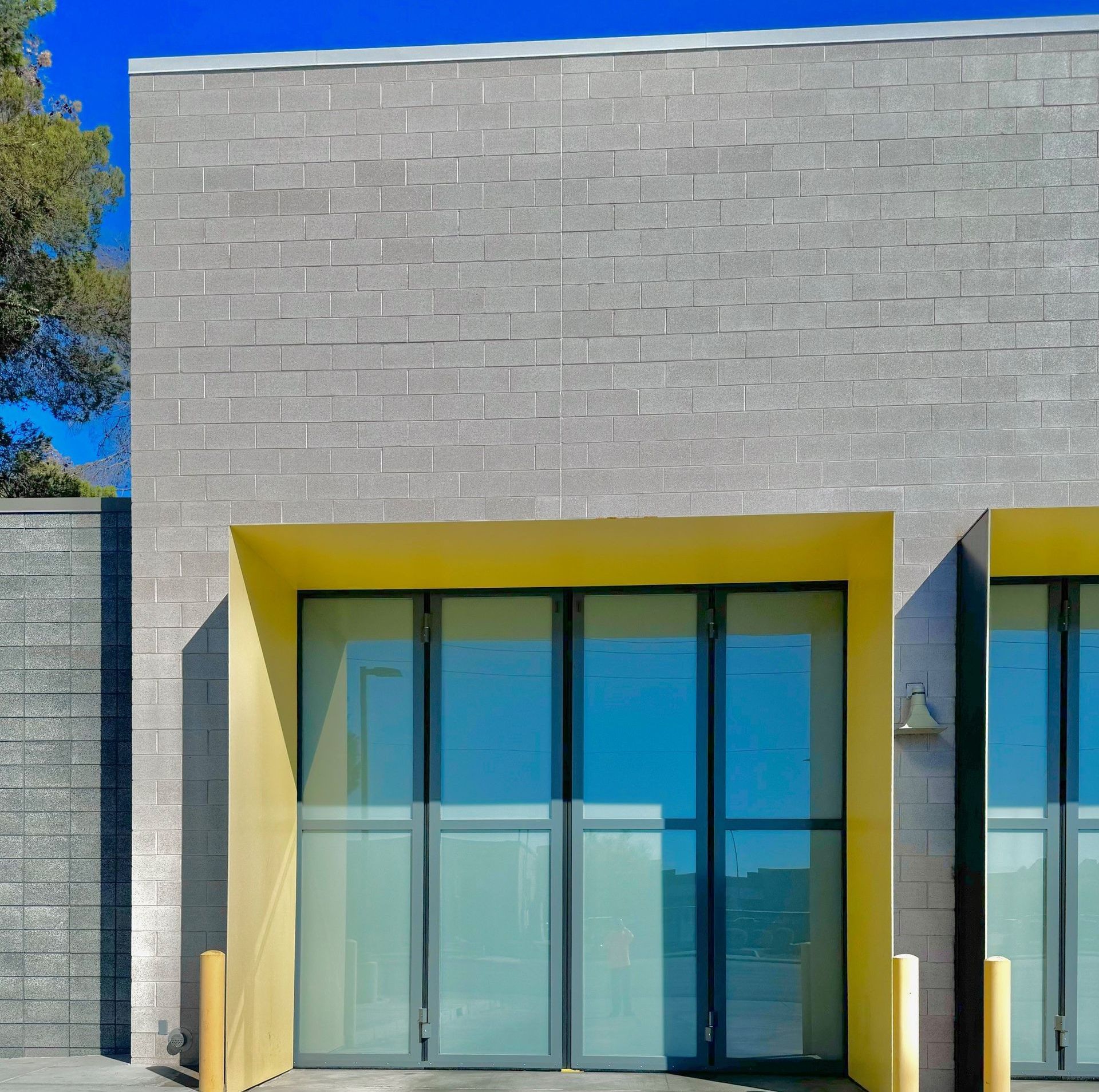 A building with a yellow roof and a lot of windows