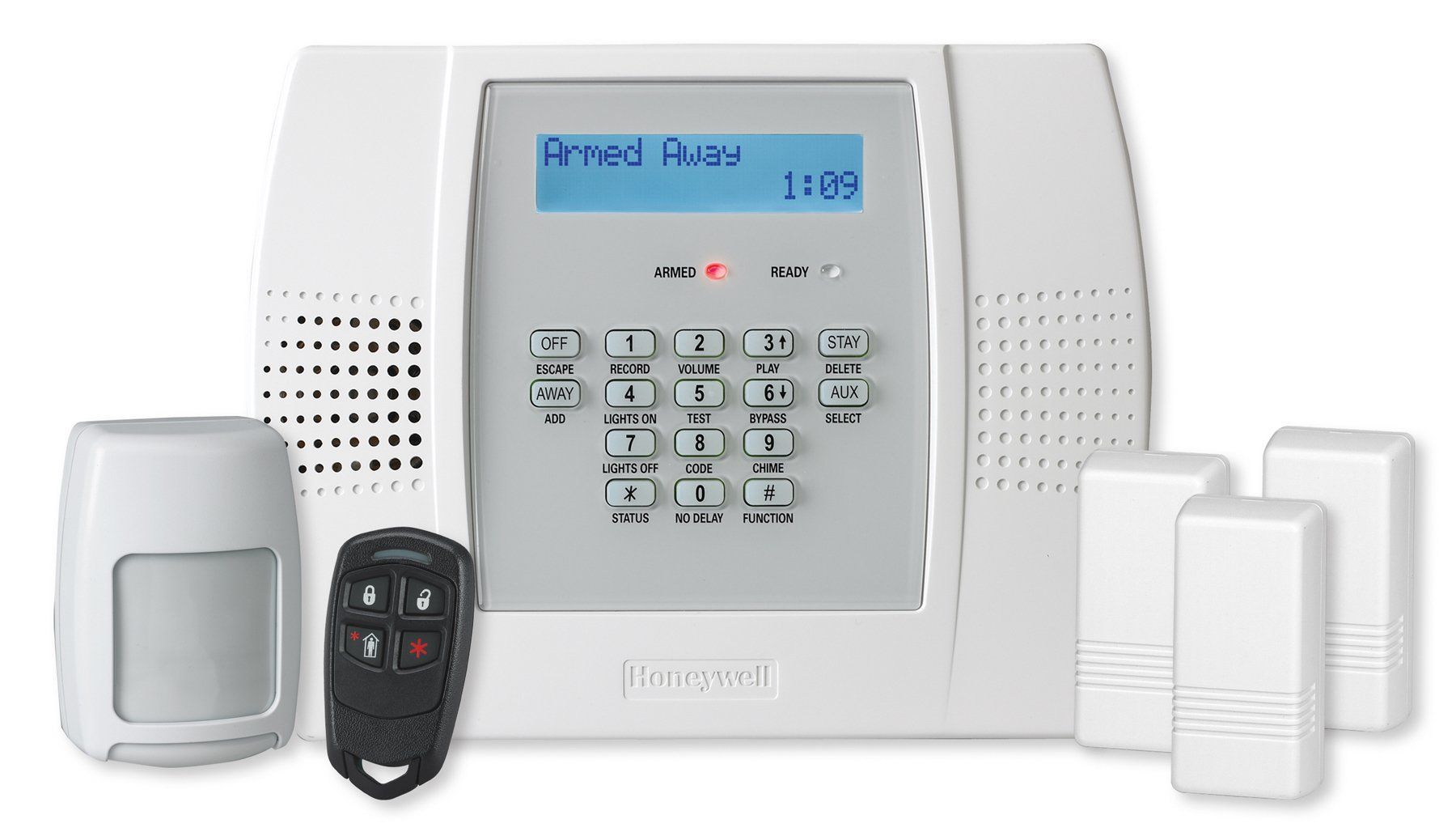A Honeywell home security system kit including a white keypad, motion sensor, key fob, and door sensors.