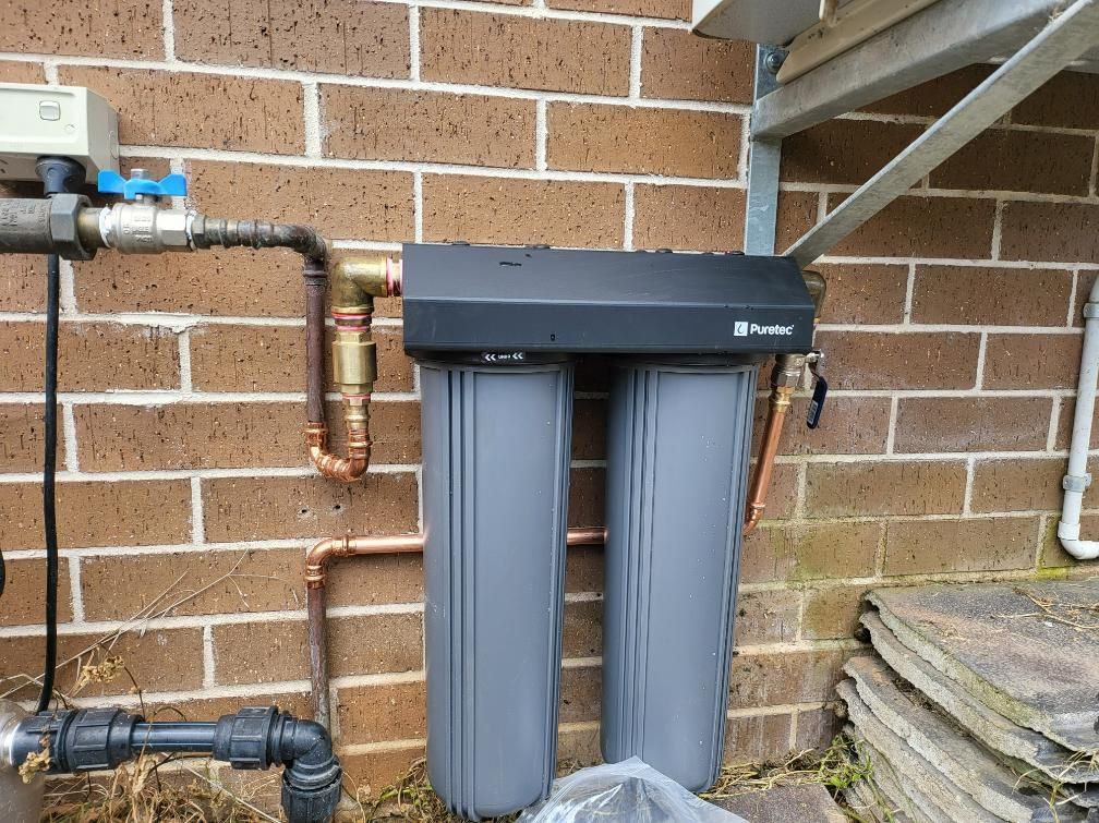 Water Filter is Attached to a Brick Wall — Peel Irrigation & Water Supplies in Taminda, NSW