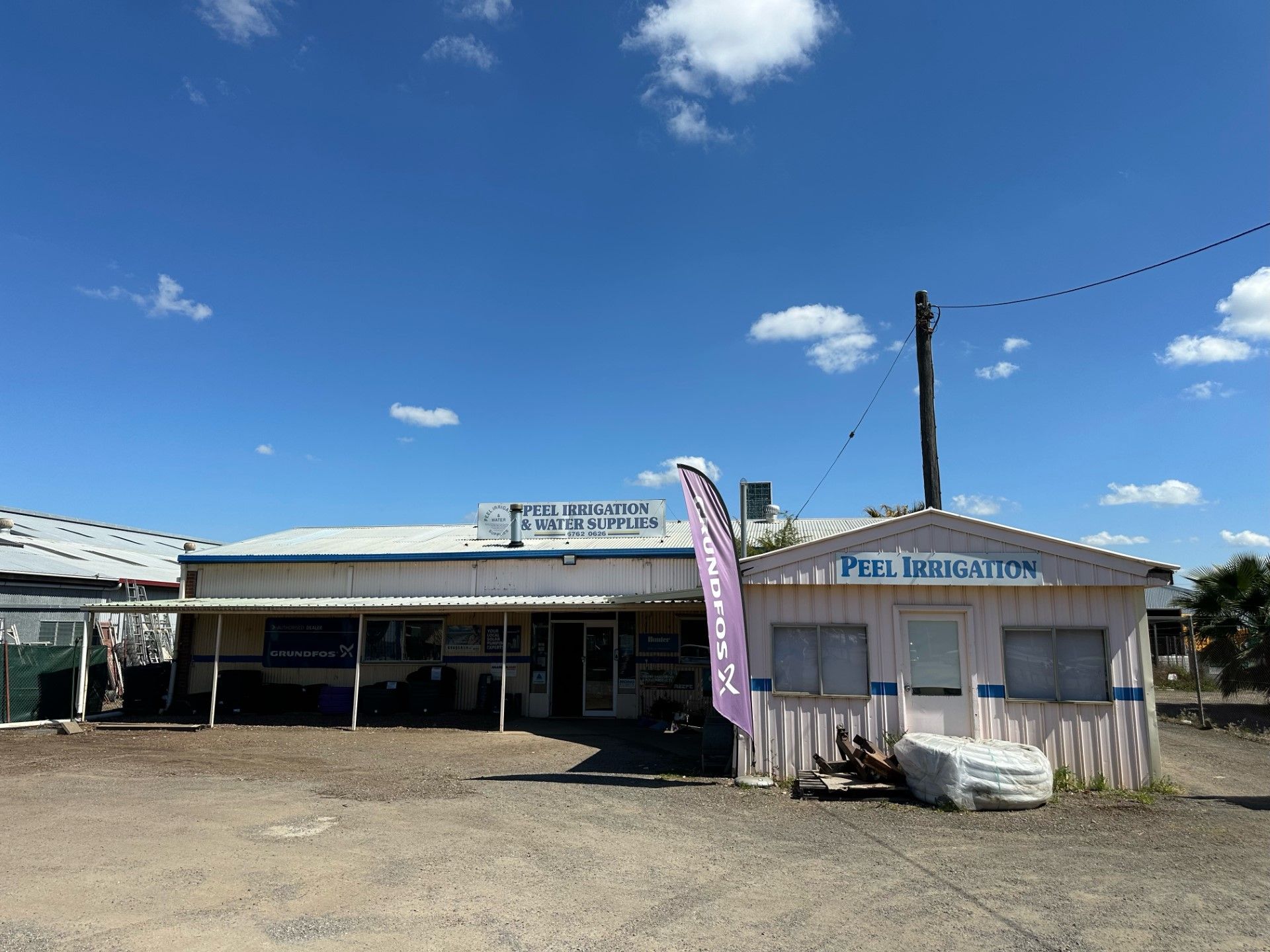 White Truck is Parked Next to a Water Pump — Peel Irrigation & Water Supplies in Taminda, NSW