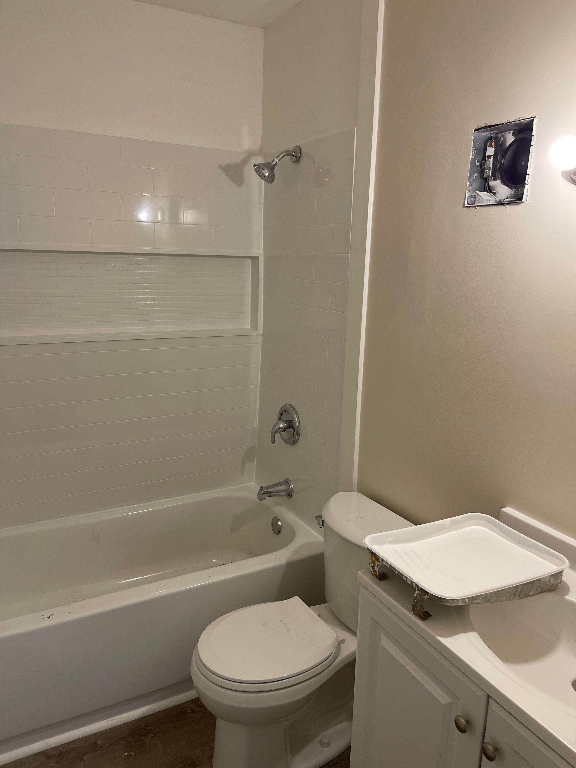 A bathroom with a toilet a bathtub and a sink