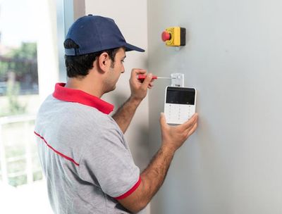 Man Installing Security Alarm System — Sonbert Security Systems Inc. — Winston Salem, North Carolina