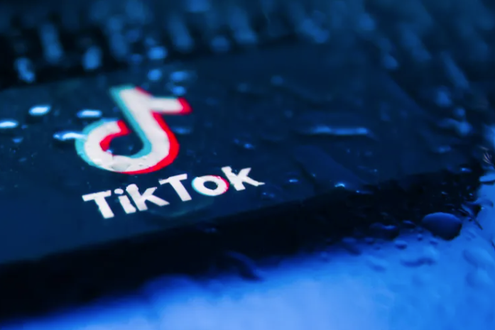 TikTok logo seen thru wet window
