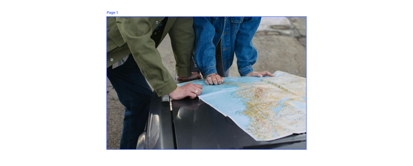 people looking at a map on the hood