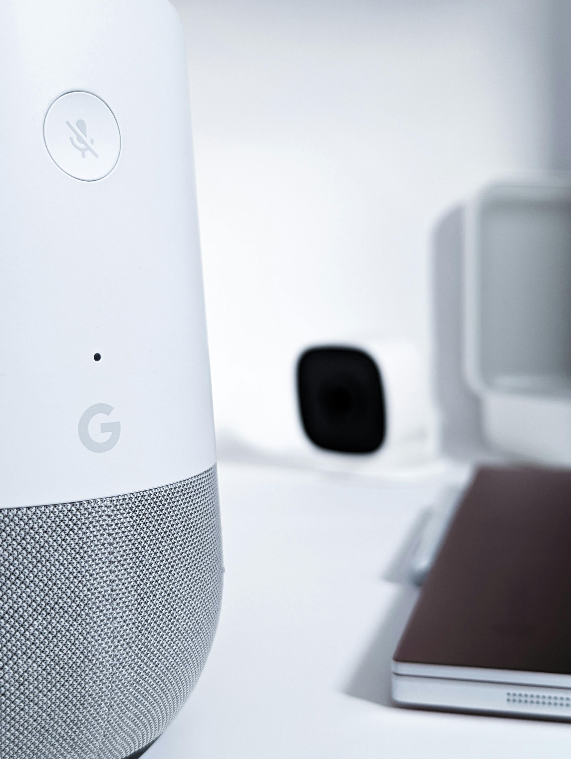 A close up of a google home speaker on a table