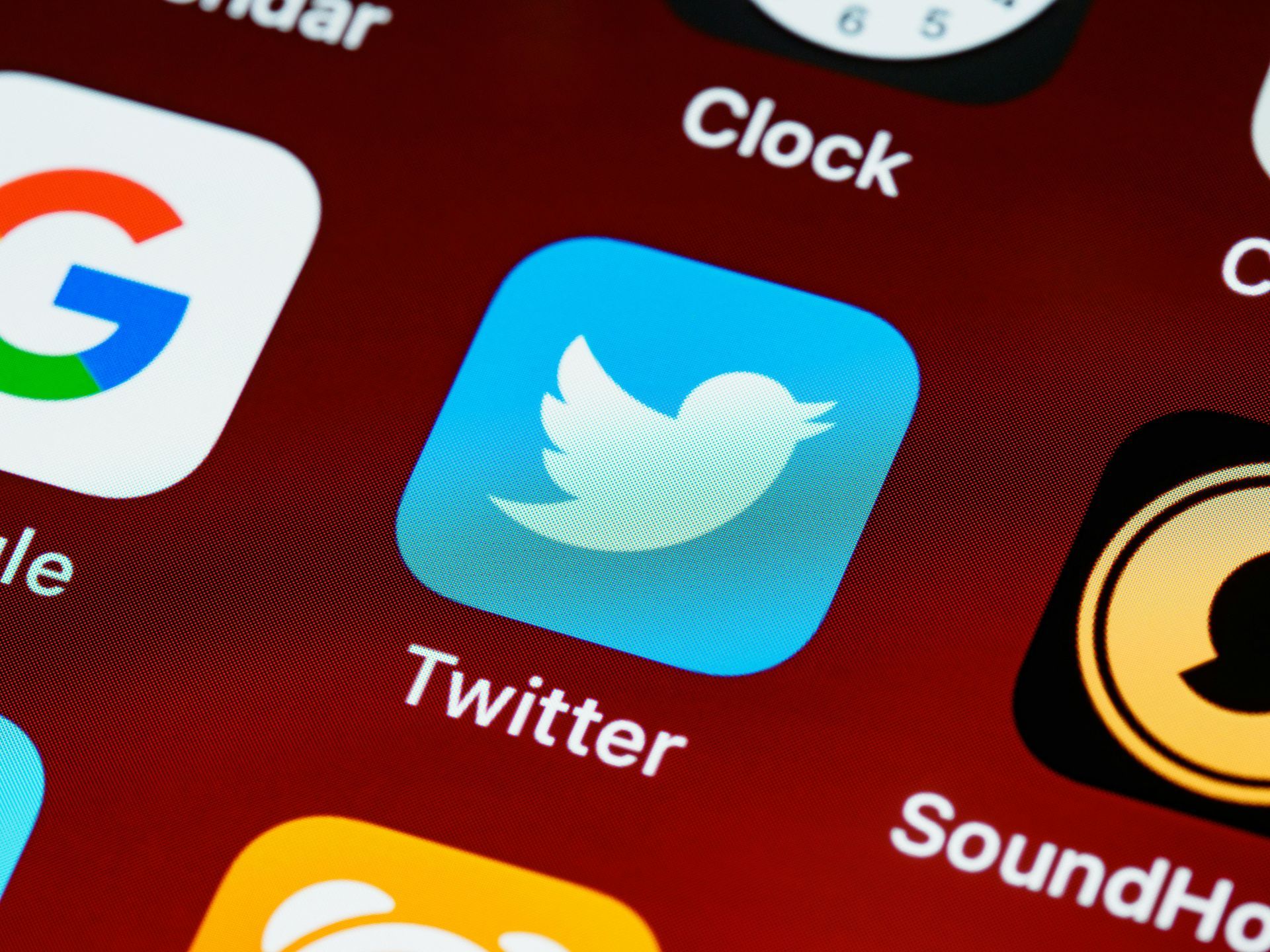 A close up of the twitter app on a phone