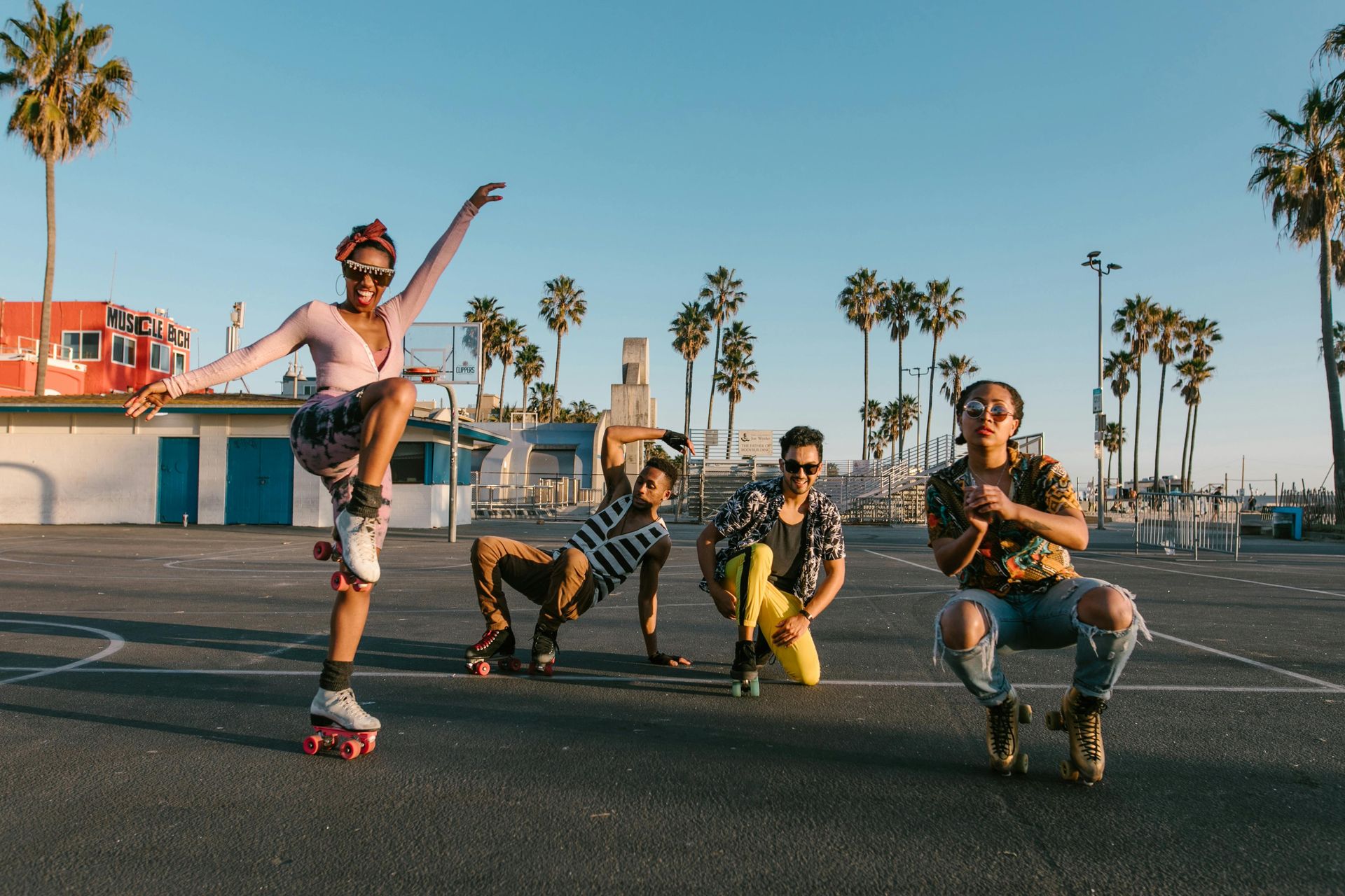 A group of people are rollerblading in a parking lot.